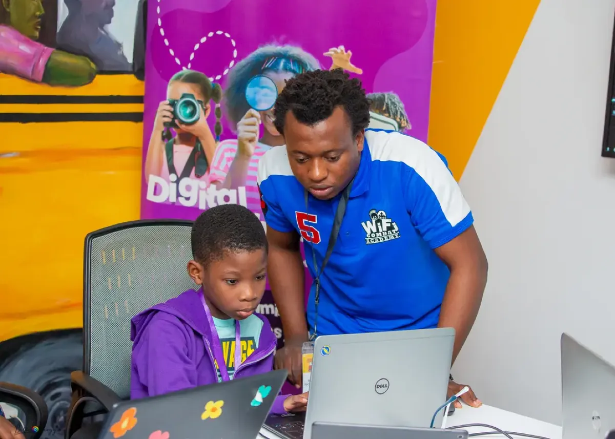 A student learning to code with an instructor